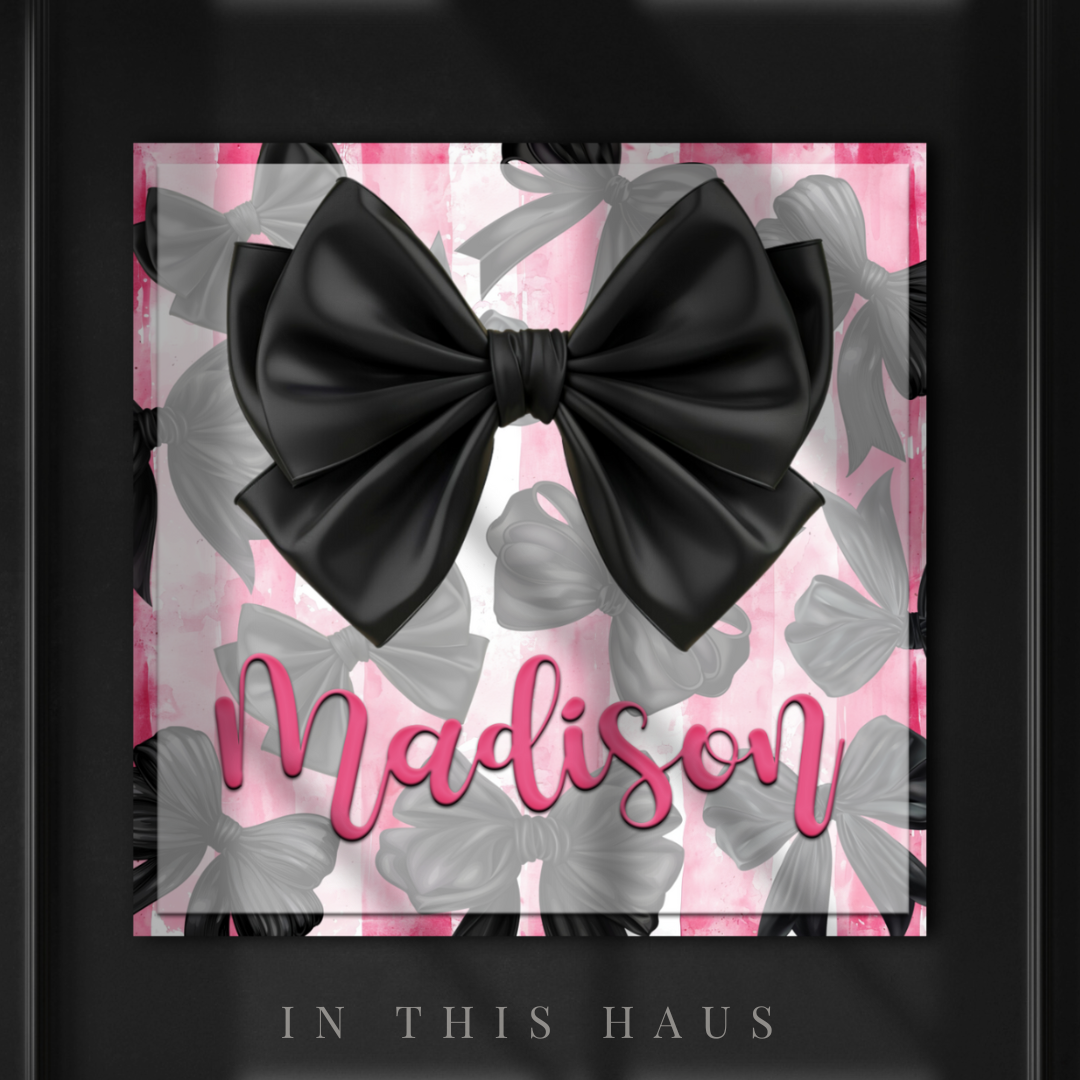 Madison Personalized Bow Canvas featuring a custom name on a pink and black bow background.