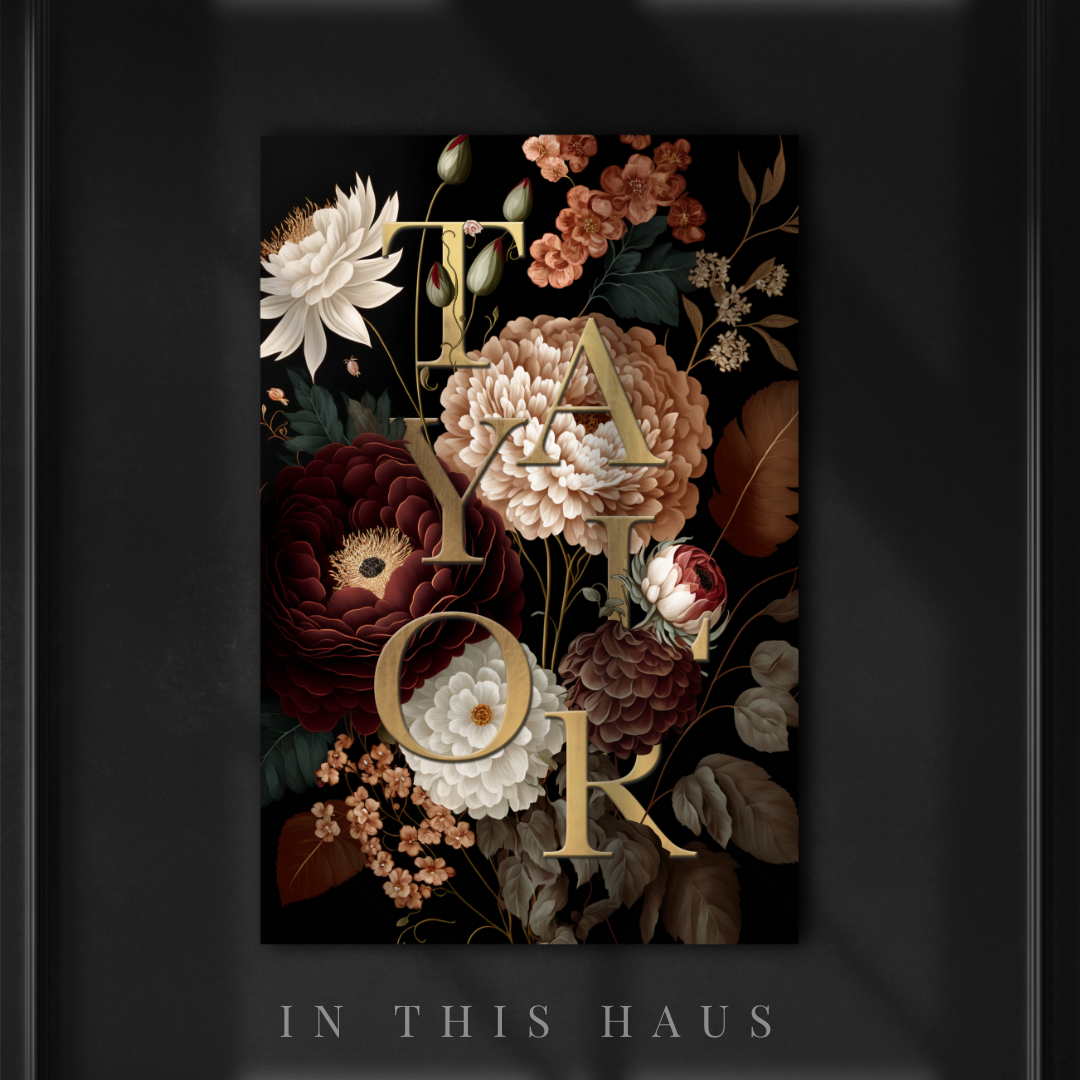 Elegant floral name sign with personalized gold lettering and deep, warm-toned flowers.