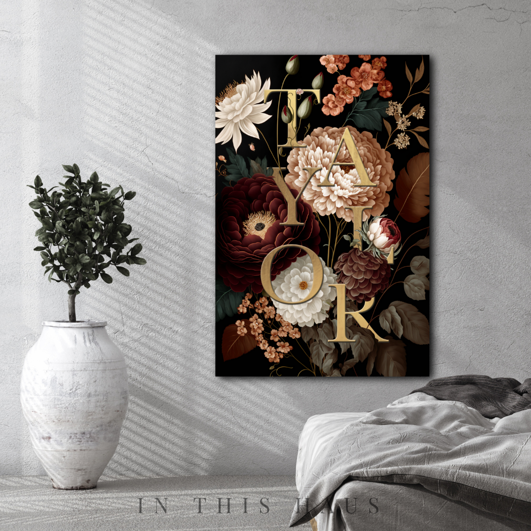 Close-up of custom floral name sign showing intricate details of golden typography and floral design.