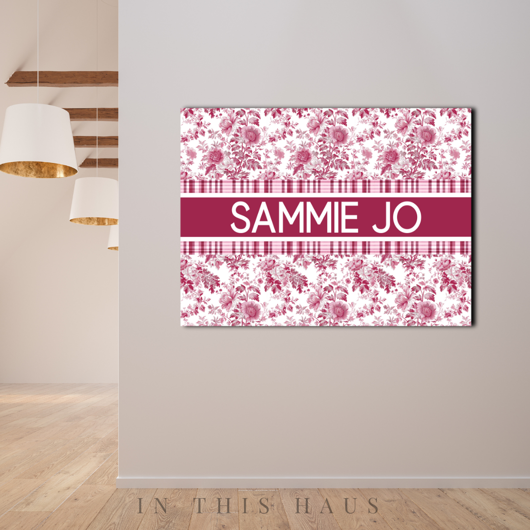 Classic French-style toile canvas displayed in a modern nursery or vintage-themed bedroom.