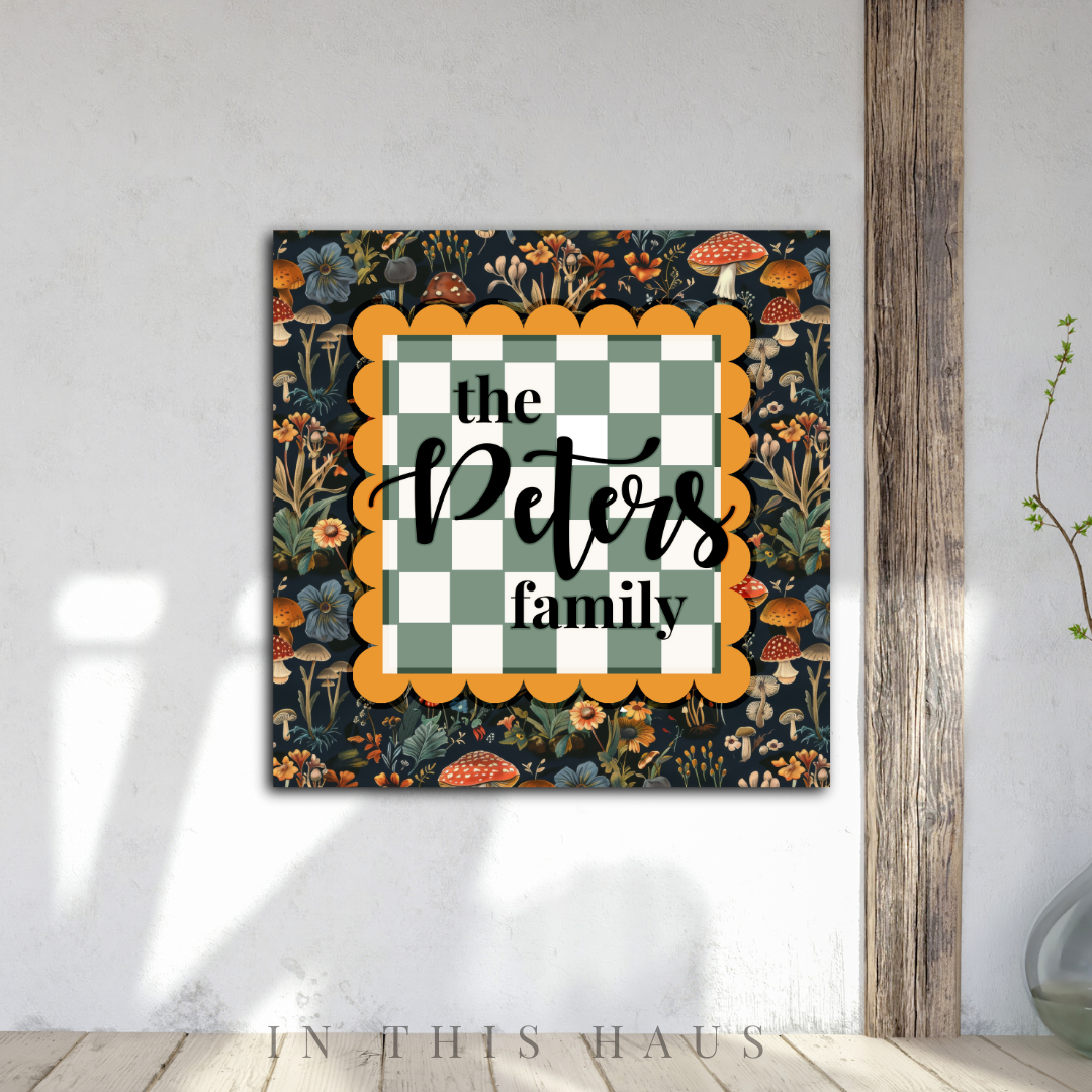 Personalized family plaque with floral mushroom pattern and green checkered design, customizable with family name.