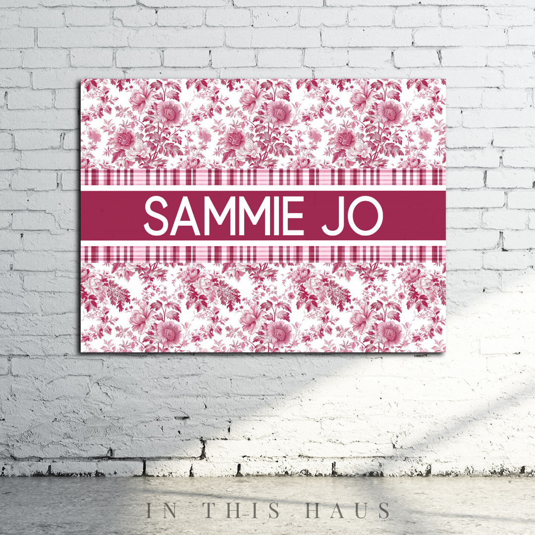 Personalized toile name canvas styled in a cozy reading nook or elegant home office.