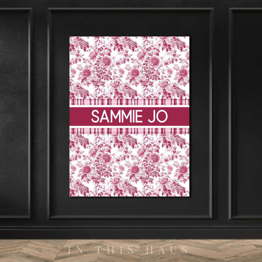 Modern nursery decor with vintage floral patterns and bold custom name design