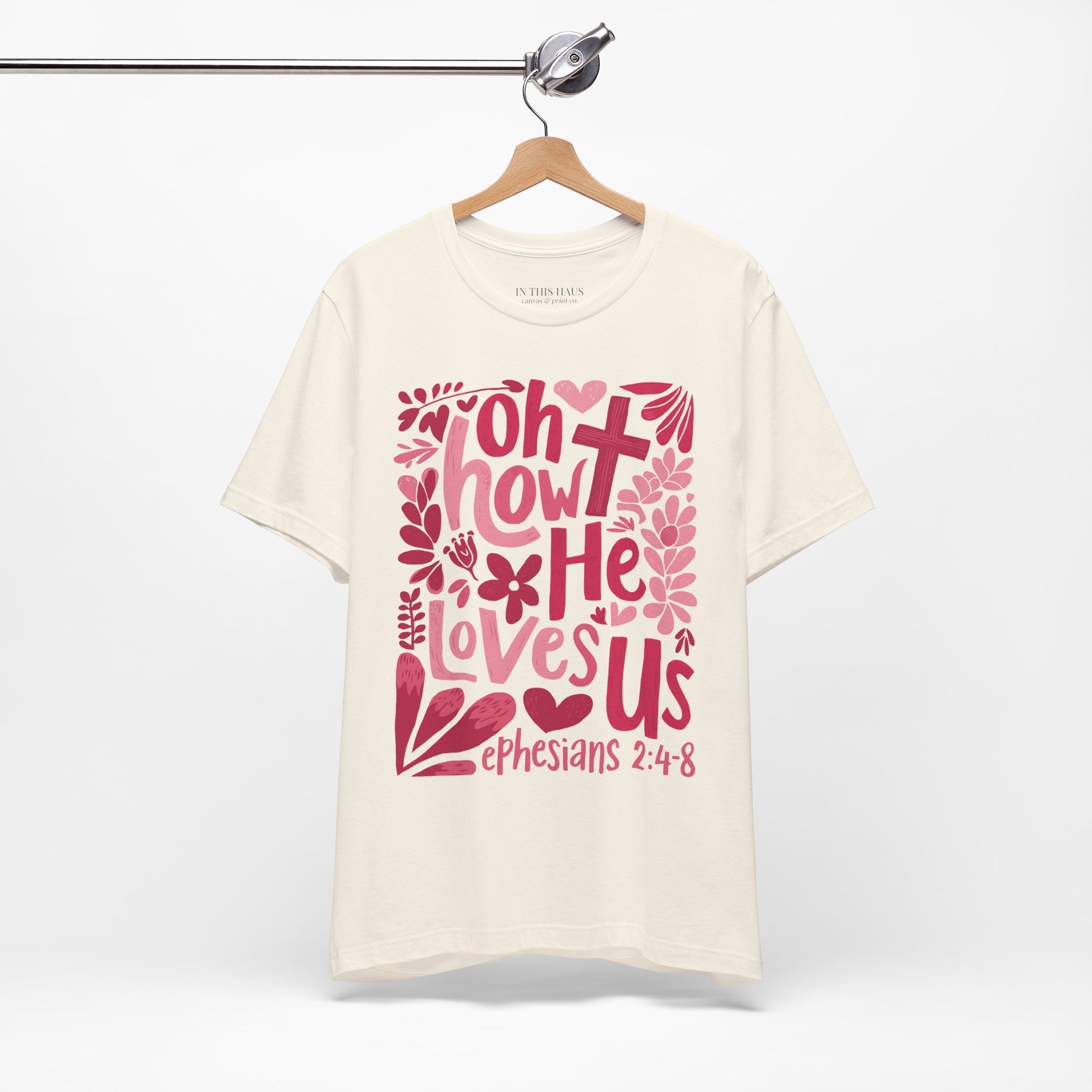 Unisex Bible verse T-shirt with floral accents.
