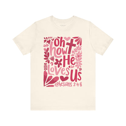 Faith-based unisex graphic tee in pink and red tones.
