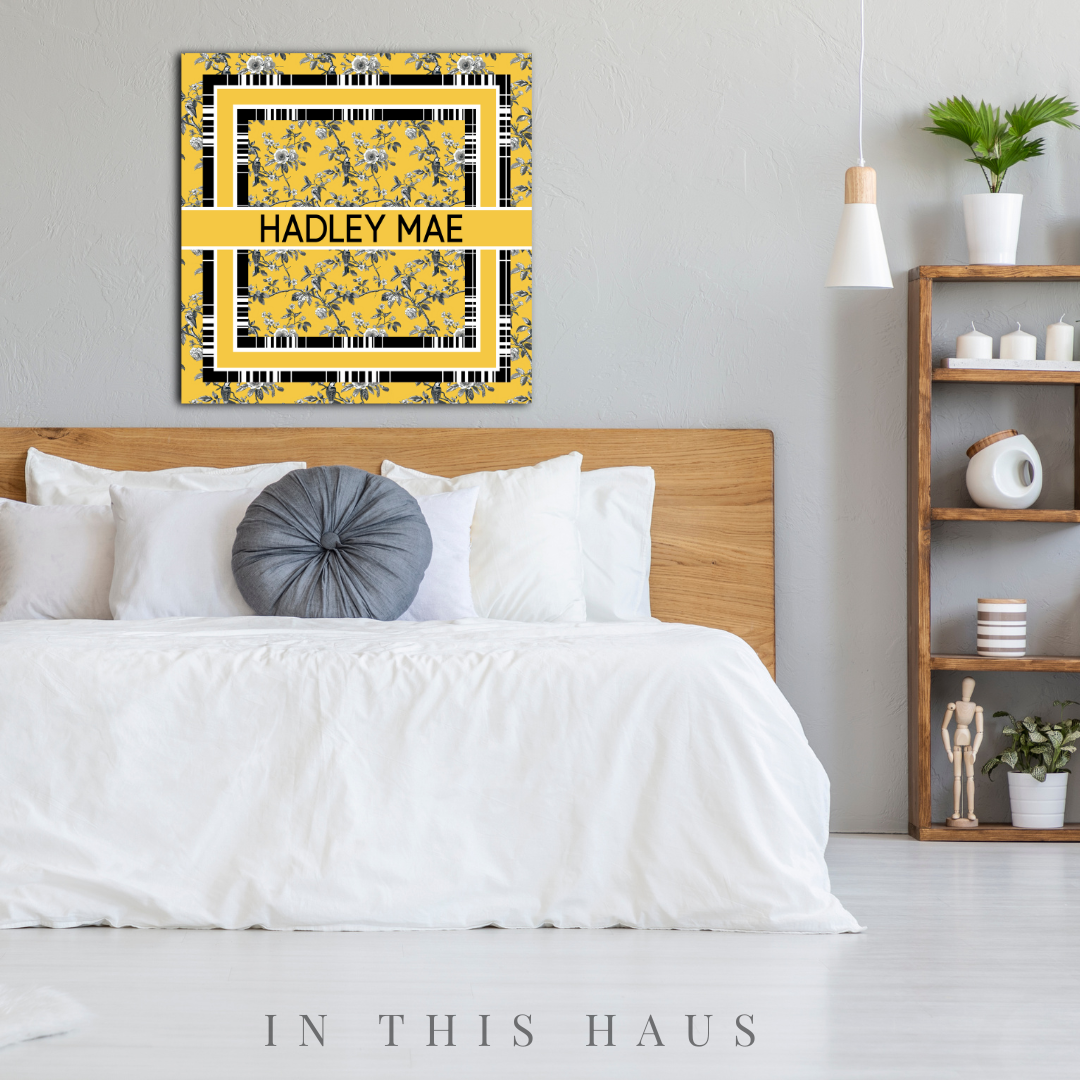Close-up of the intricate toile pattern and personalized text on the canvas.